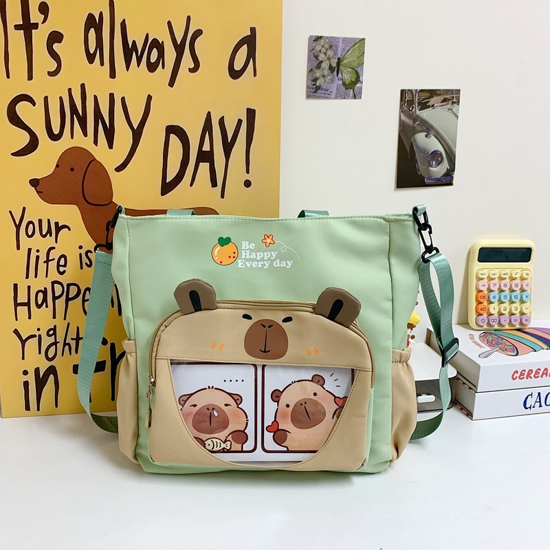 Capybara Oxford anyagból készült vízálló oldaltáska általános iskolás lányoknak, állatmintás, poliészter bélés, ősz 2025