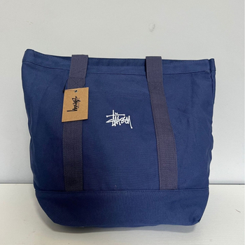 Stussy Canvas Tote Bag – Mestská jednoduchosť, plátený materiál, vodorovný štvorcový tvar, otvorené horné otváranie, vrecko na telefón, dvojité rúčky