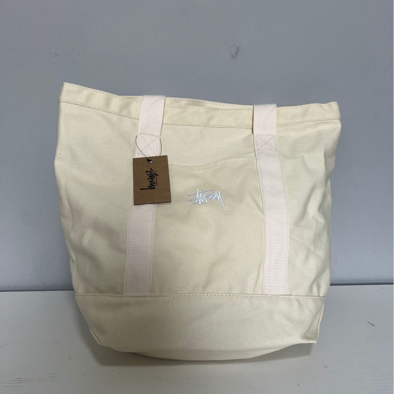 Stussy Canvas Tote Bag – Mestská jednoduchosť, plátený materiál, vodorovný štvorcový tvar, otvorené horné otváranie, vrecko na telefón, dvojité rúčky