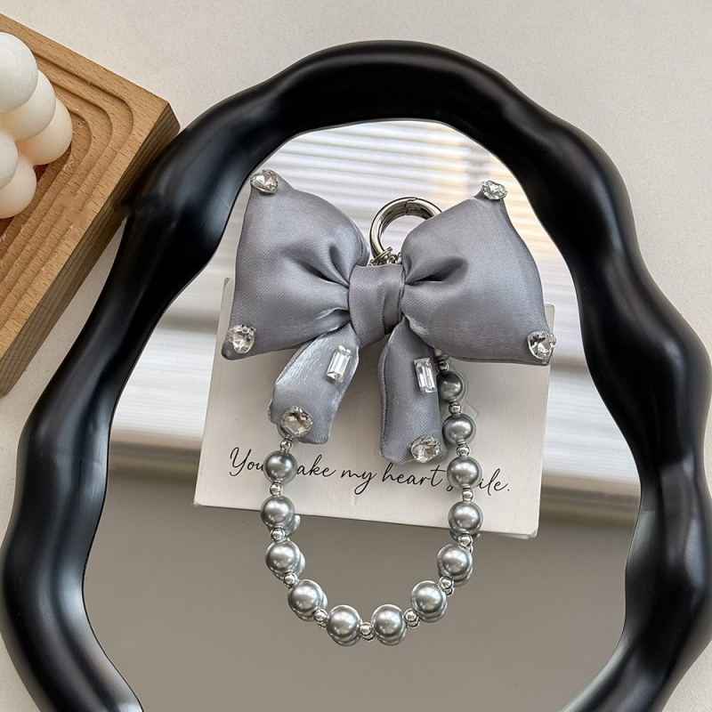 Mobiltelefon zsinór gyöngyökkel és masnival, kézzel készített, PVC zsinór, fém csat