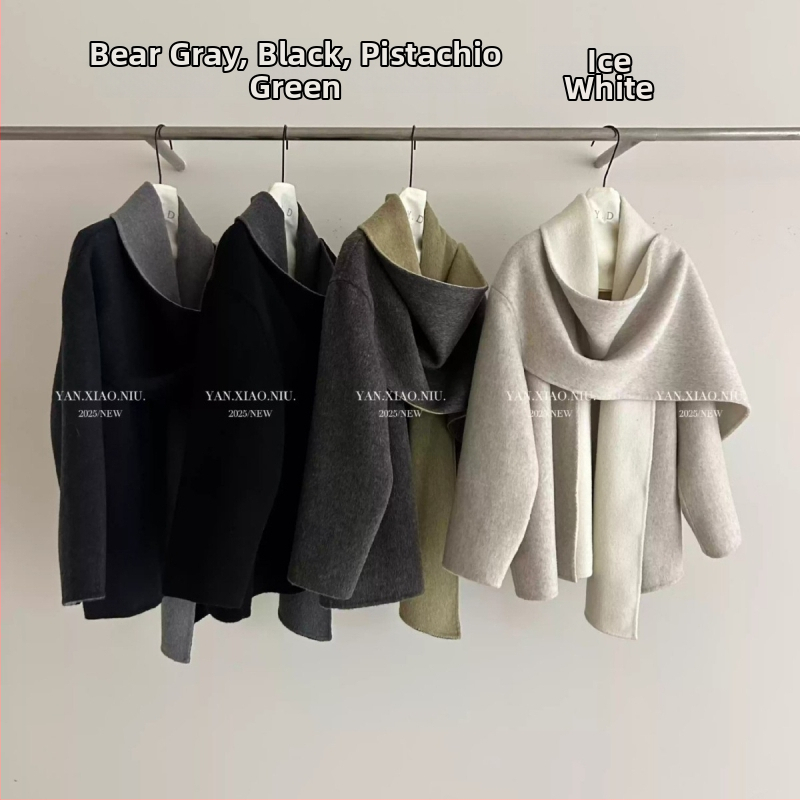 Moterų vilnos cape stiliaus paltas, vilnos mišinys 80–90% vilnos, ilgas, laisvas kirpimas, paslėptas sagų užsegimas, ilgos rankovės, pavasaris 2025