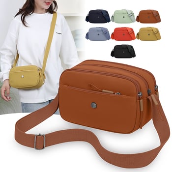 Crossbody torbica od Oxford materijala, horizontalnog kvadratnog oblika, zatvaranje na zip, laminirani unutarnji džep, jedan kaiš