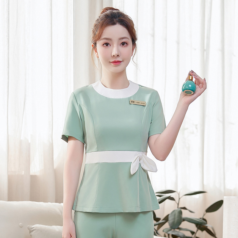 Ženská uniforma do kozmetického salónu – rýchloschnúci materiál, zmes polyesteru a elastanu, krátke rukávy, kruhový výstrih, nohavice