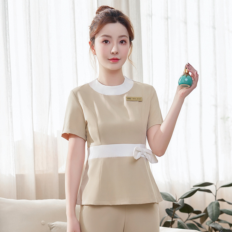 Ženská uniforma do kozmetického salónu – rýchloschnúci materiál, zmes polyesteru a elastanu, krátke rukávy, kruhový výstrih, nohavice