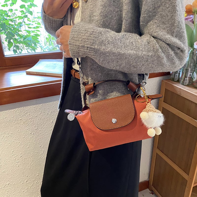 Ženska crossbody torba u obliku knedle, PVC materijal, džep za mobitel, zatvarač s poklopcem, ulični stil