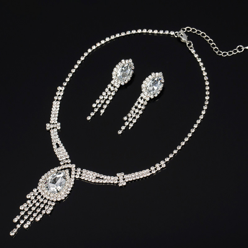 Set nakita: naušnice i ogrlica od kristala, lanac s perlama (bead chain), privjesak od umjetnog kristala; uzorci: Ljubavno srce, Kapljica, Zvono