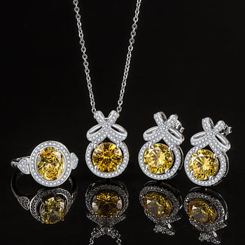 Réz ékszerszett: nyaklánc, fülbevaló és gyűrű; Bow motívum, réz medál, O-lánc, elektroplatált felület; geometriai stílus