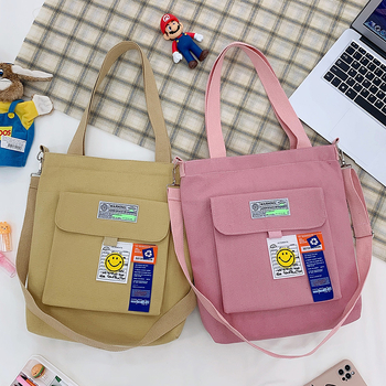 Torba preko ramena od platna, gradski minimalistički stil, uspravni kvadratni oblik, zatvarač, unutarnje pretinice za laptop, karticu/ID, pretinica sa zatvaranjem