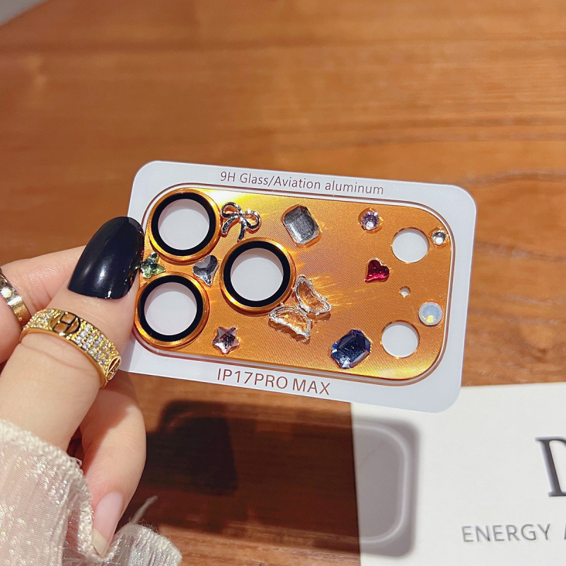 Prsteň ochrany objektívu fotoaparátu pre iPhone 17 s rhinestones, diamantovou vsadkou a hviezdičkovým motívom