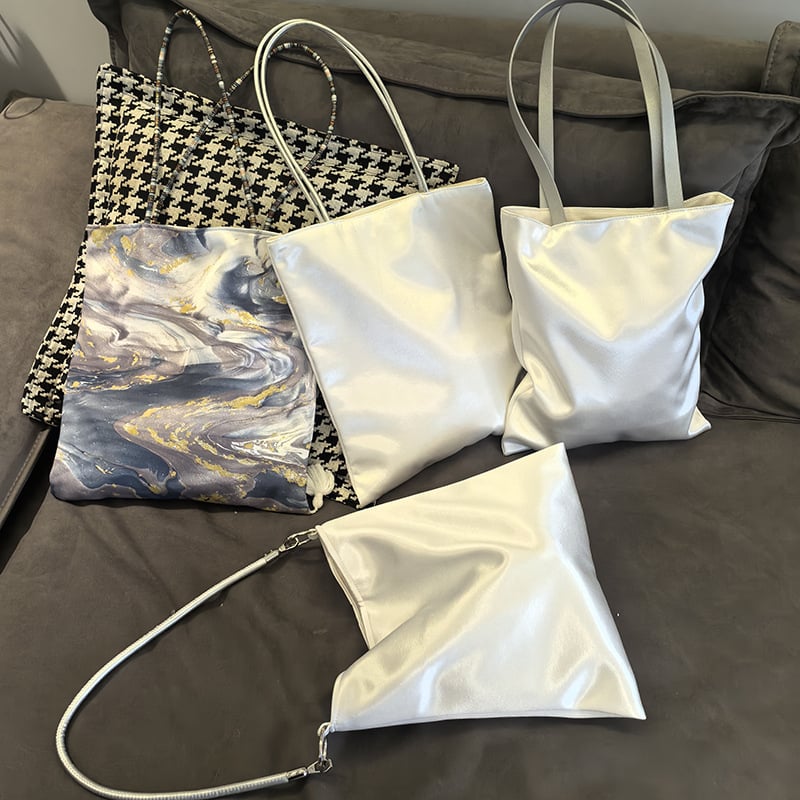 Ženska svilenkasta torba preko ramena, kibiro veida forma, zatvaranje kopčom, džep za kameru, podstava od platna