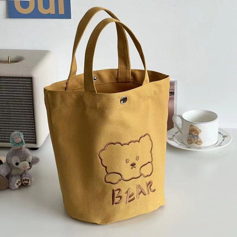 Ženska platnena bucket torba, gradski minimalistički stil, uspravni kvadratni oblik, dvostruke naramenice, za svakodnevnu upotrebu