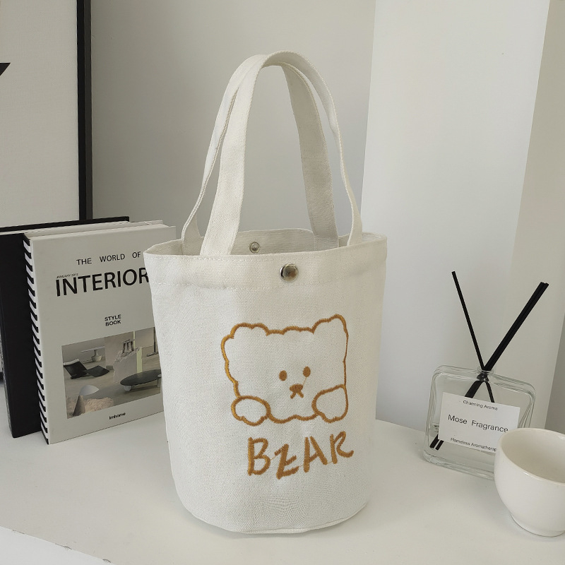 Ženska platnena bucket torba, gradski minimalistički stil, uspravni kvadratni oblik, dvostruke naramenice, za svakodnevnu upotrebu
