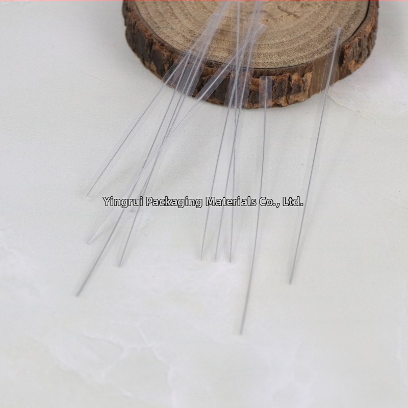 Keskkonnasõbralik läbipaistev sidumisvard toidu pakkimiseks ja DIY lilleprojektide jaoks; Materjal: läbipaistev komposiitfilmi kattega galvaniseeritud traat; Mõõtmed: 4x250; Paksus: 0,4; Privaatne märgistamine saadaval