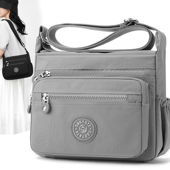 Nylon keresztpántos táska, vízálló, cipzáras zárás, nagy kapacitású belső zsebbel (telefonzseb és zipzáras zseb), vászon bélés