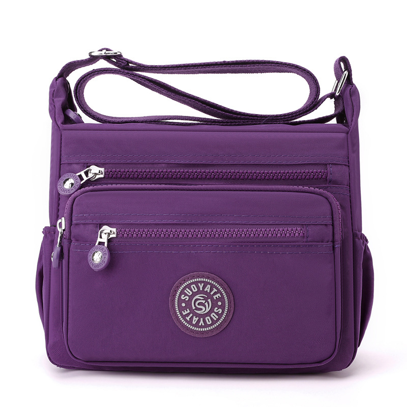 Nylon keresztpántos táska, vízálló, cipzáras zárás, nagy kapacitású belső zsebbel (telefonzseb és zipzáras zseb), vászon bélés