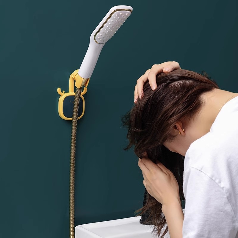 Suport de duș montaj fără găuri — din plastic, suport reglabil pentru cap de duș, stil desene animate, brand Initial Benefit