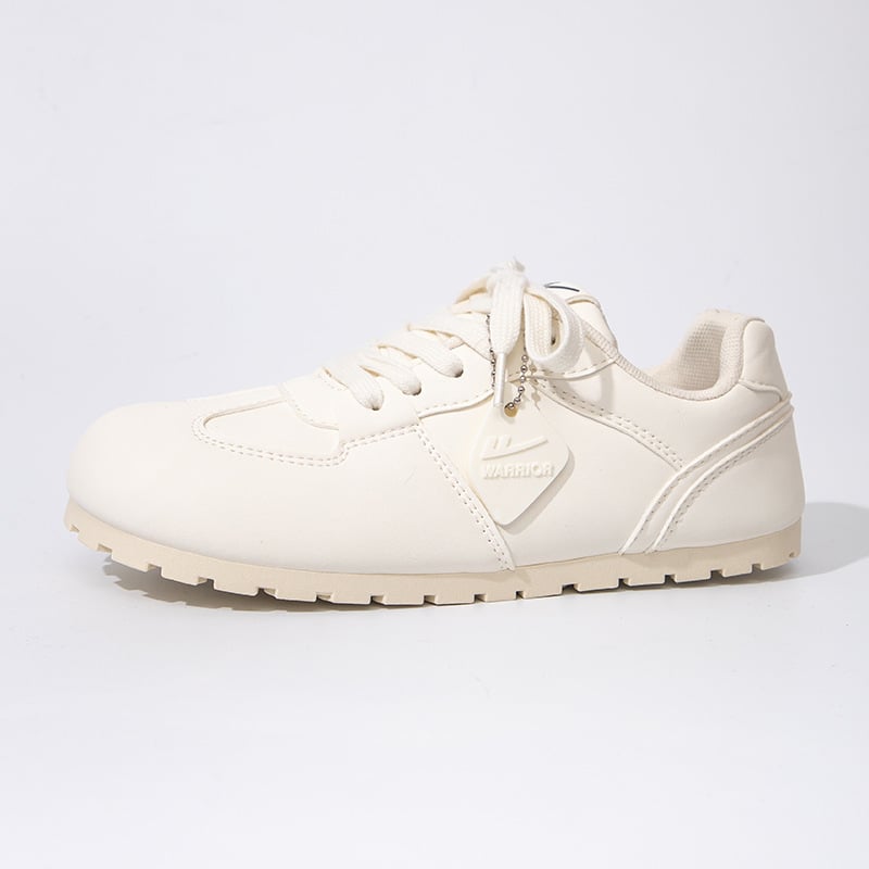 Női edzőcipő kerek orrú, felső része szintetikus bőr, alacsony sarok 1-3 cm, fűzővel záródó, PVC talp