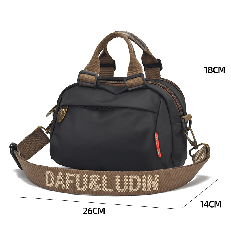 Ženska crossbody torba, gradski minimalistički stil, Oxford tkanina, zatvarač, podstava od najlona, vodoravni kvadratni oblik, više pretinaca