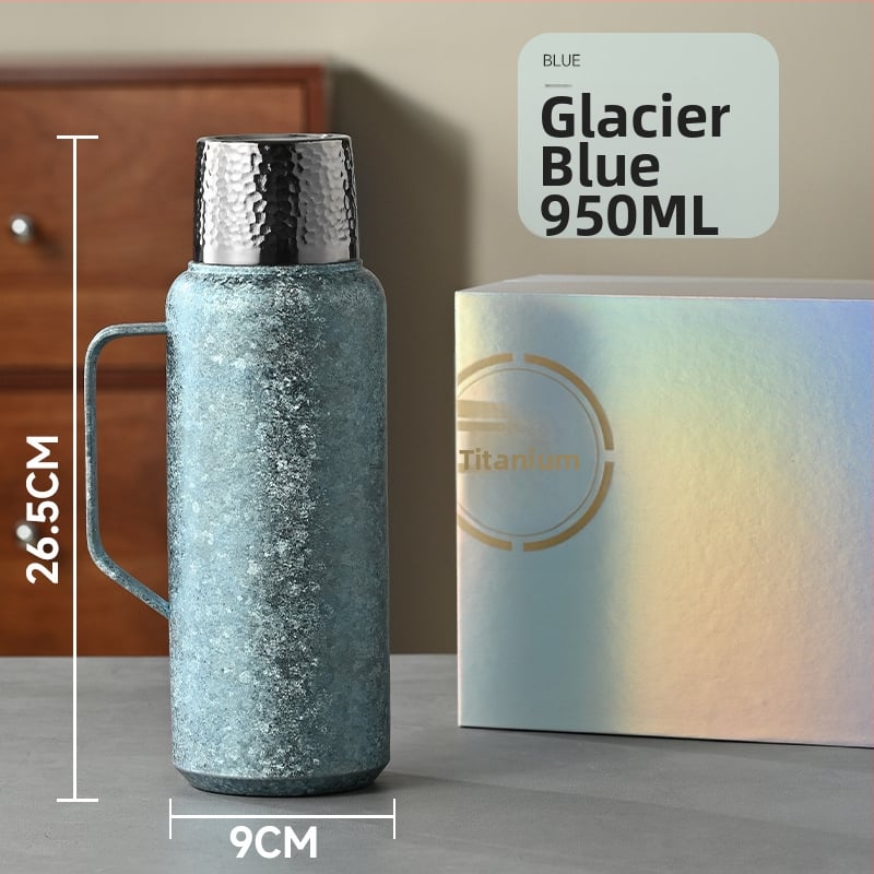 Tiszta titán termosz vákuum-szigeteltséggel, mechanikus hőmérővel, tea rekesszel és pop-up fedéllel.