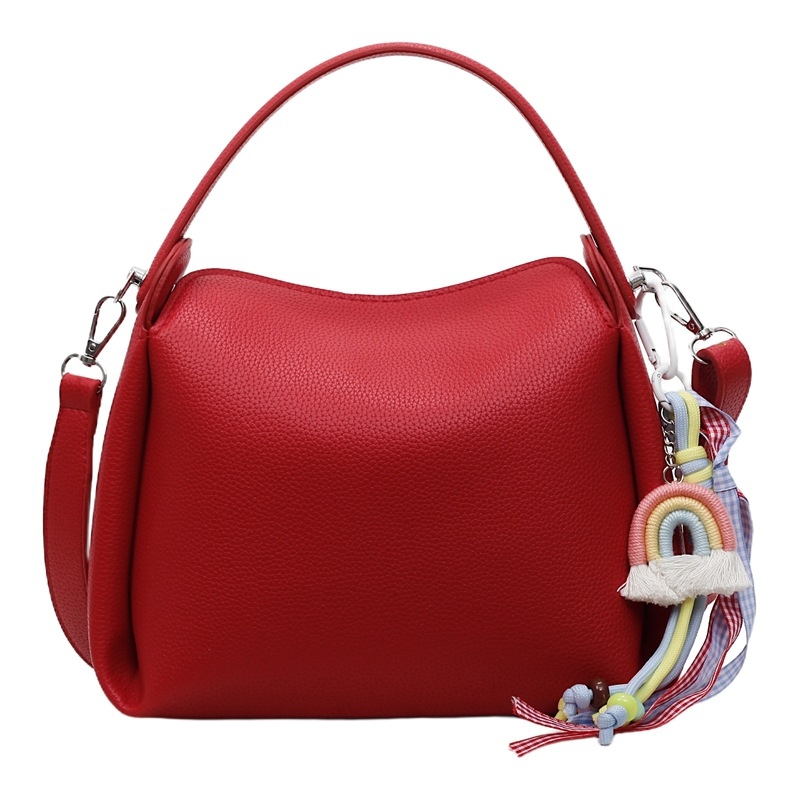 Crossbody torba od PU materijala, cilindričnog oblika, zatvarač, unutarnji pretinac za mobitel