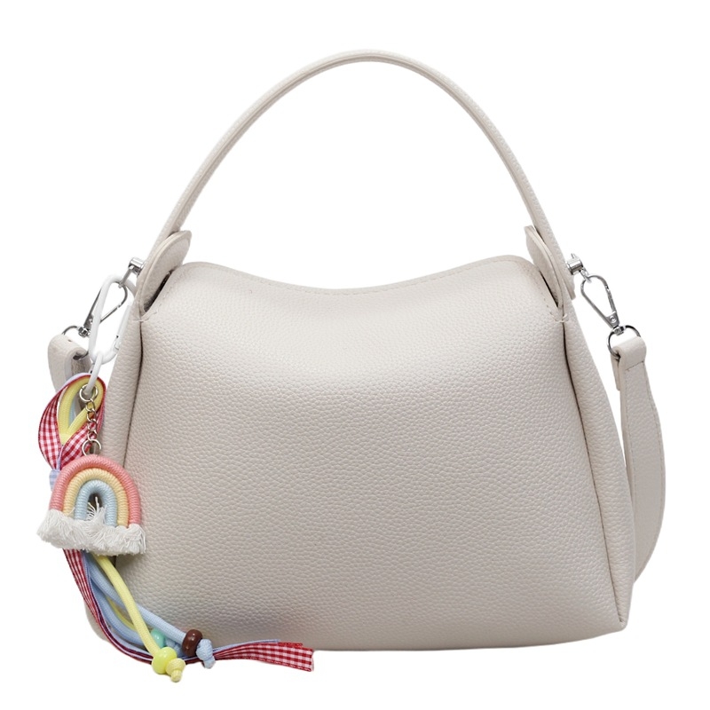 Crossbody torba od PU materijala, cilindričnog oblika, zatvarač, unutarnji pretinac za mobitel