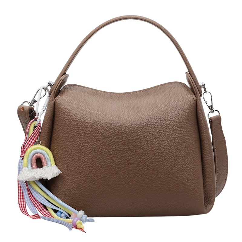 Crossbody torba od PU materijala, cilindričnog oblika, zatvarač, unutarnji pretinac za mobitel