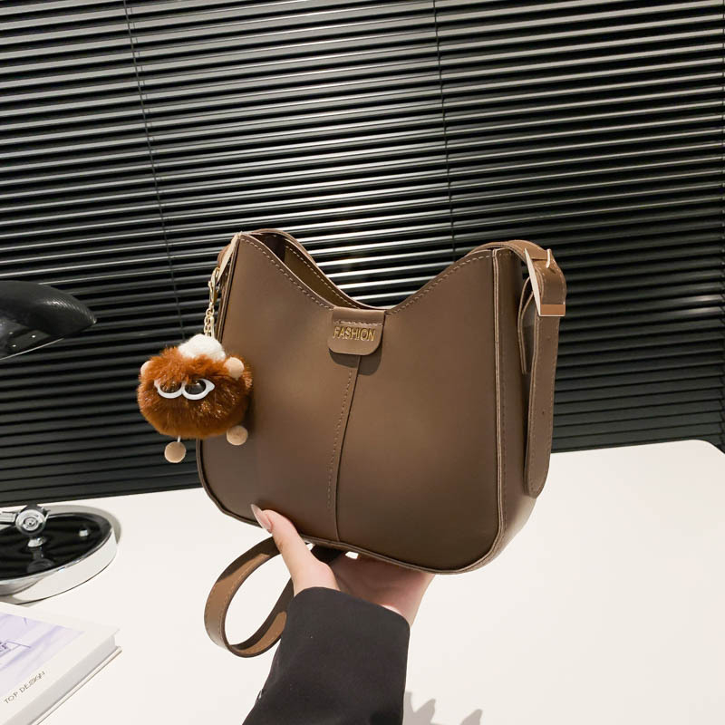 Bucket torba, urbani minimalistički stil, PU materijal, oblik koše, zatvarač, poliester podstava
