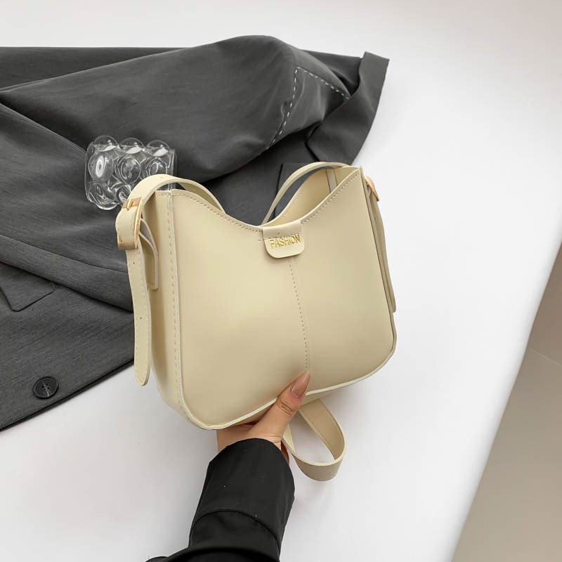 Bucket torba, urbani minimalistički stil, PU materijal, oblik koše, zatvarač, poliester podstava