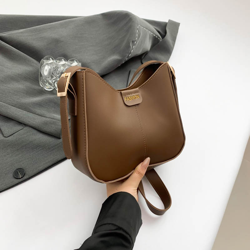 Bucket torba, urbani minimalistički stil, PU materijal, oblik koše, zatvarač, poliester podstava