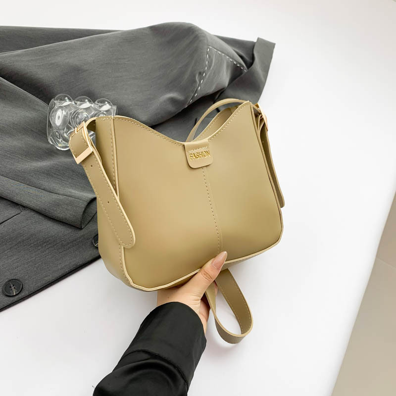 Bucket torba, urbani minimalistički stil, PU materijal, oblik koše, zatvarač, poliester podstava