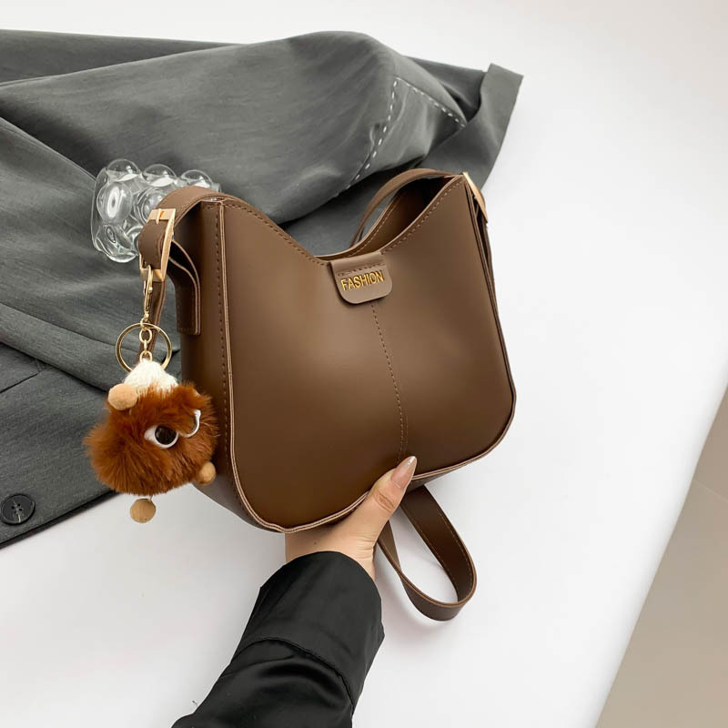 Bucket torba, urbani minimalistički stil, PU materijal, oblik koše, zatvarač, poliester podstava