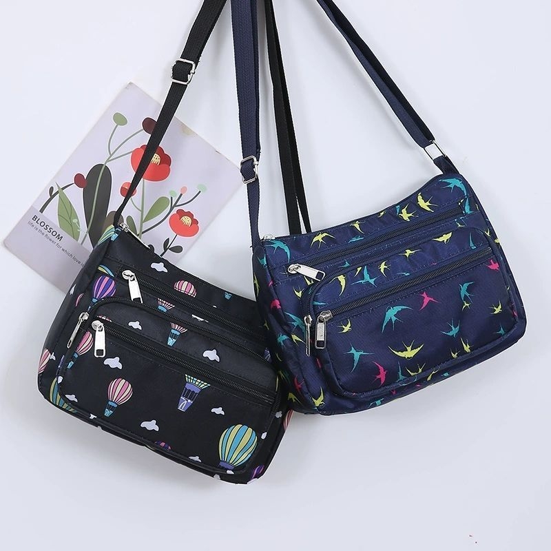 Ženska crossbody torba, gradski minimalistički stil, poliester, Dumpling bag trend, svakodnevna upotreba, zima 2023