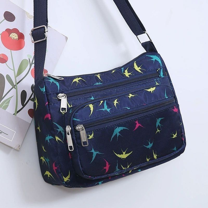 Ženska crossbody torba, gradski minimalistički stil, poliester, Dumpling bag trend, svakodnevna upotreba, zima 2023