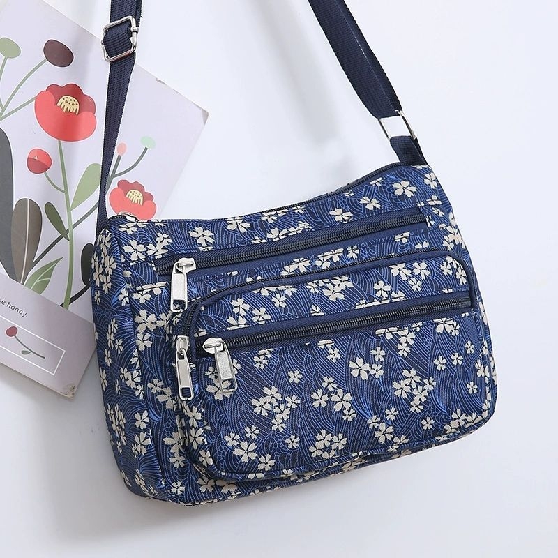 Ženska crossbody torba, gradski minimalistički stil, poliester, Dumpling bag trend, svakodnevna upotreba, zima 2023