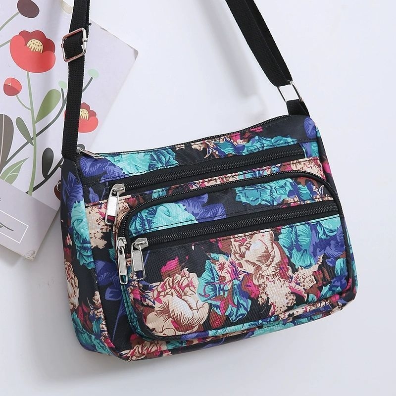 Ženska crossbody torba, gradski minimalistički stil, poliester, Dumpling bag trend, svakodnevna upotreba, zima 2023