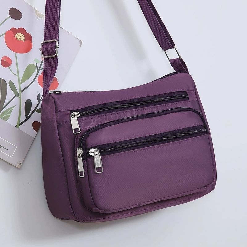 Ženska crossbody torba, gradski minimalistički stil, poliester, Dumpling bag trend, svakodnevna upotreba, zima 2023
