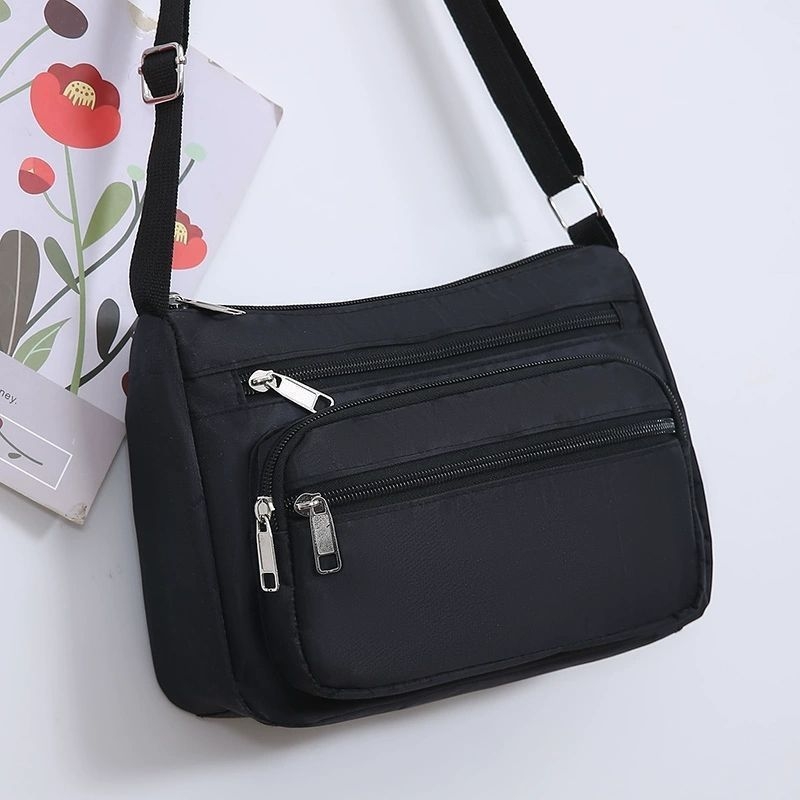 Ženska crossbody torba, gradski minimalistički stil, poliester, Dumpling bag trend, svakodnevna upotreba, zima 2023