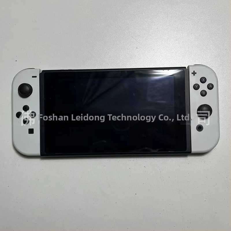 Nintendo Switch display model NS su valdikliu – vitrinos rekvizitas (Modelis:NS; Dėžė: priimančioji vienetė, 1 rankinis valdiklis, 1 pora; Svoris: 400 g; Žaidimo versija: paperback)