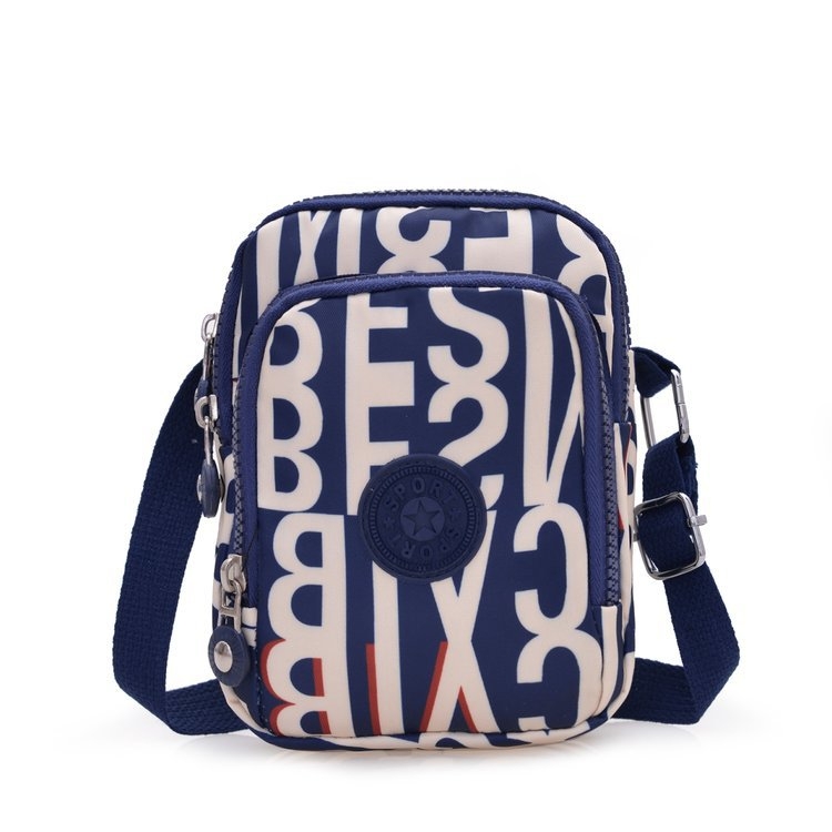 Vertikalna crossbody torbica od Oxford platna, poliester podstava, ovalni oblik, zatvaranje na zip, unutarnji džep sa zipom