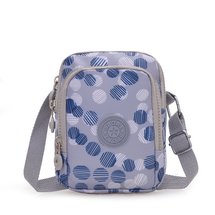 Vertikalna crossbody torbica od Oxford platna, poliester podstava, ovalni oblik, zatvaranje na zip, unutarnji džep sa zipom