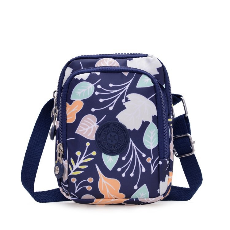 Vertikalna crossbody torbica od Oxford platna, poliester podstava, ovalni oblik, zatvaranje na zip, unutarnji džep sa zipom