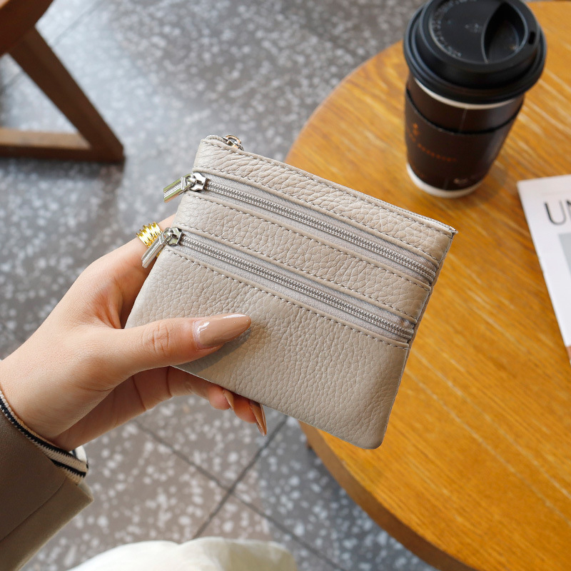 Uniszex valódi bőrből készült érmés táska, első réteg szarvasmarha bőrből, egyszínű külső, poliészter bélés, kulcs- és kártyatartó multifunkciós rekesz, kopásálló