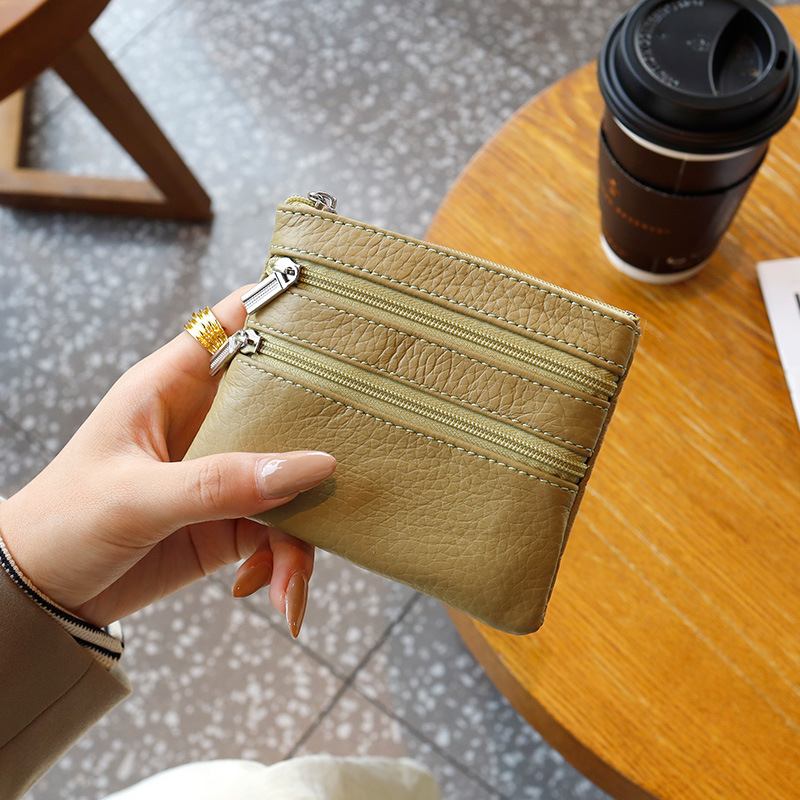 Uniszex valódi bőrből készült érmés táska, első réteg szarvasmarha bőrből, egyszínű külső, poliészter bélés, kulcs- és kártyatartó multifunkciós rekesz, kopásálló