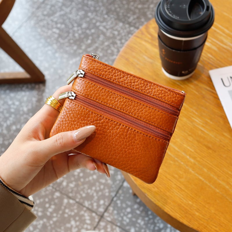 Uniszex valódi bőrből készült érmés táska, első réteg szarvasmarha bőrből, egyszínű külső, poliészter bélés, kulcs- és kártyatartó multifunkciós rekesz, kopásálló