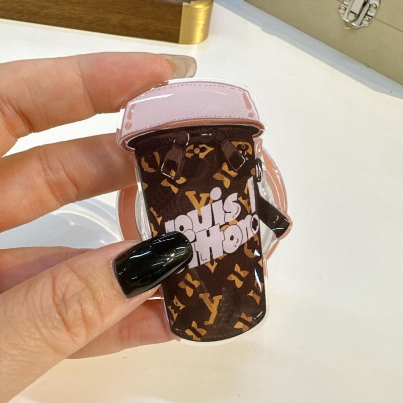 Držač za mobitel s magnetskim kućištem, povlačajući dizajn, plastični materijal, crtani stil, kompatibilan s Apple i Android uređajima.