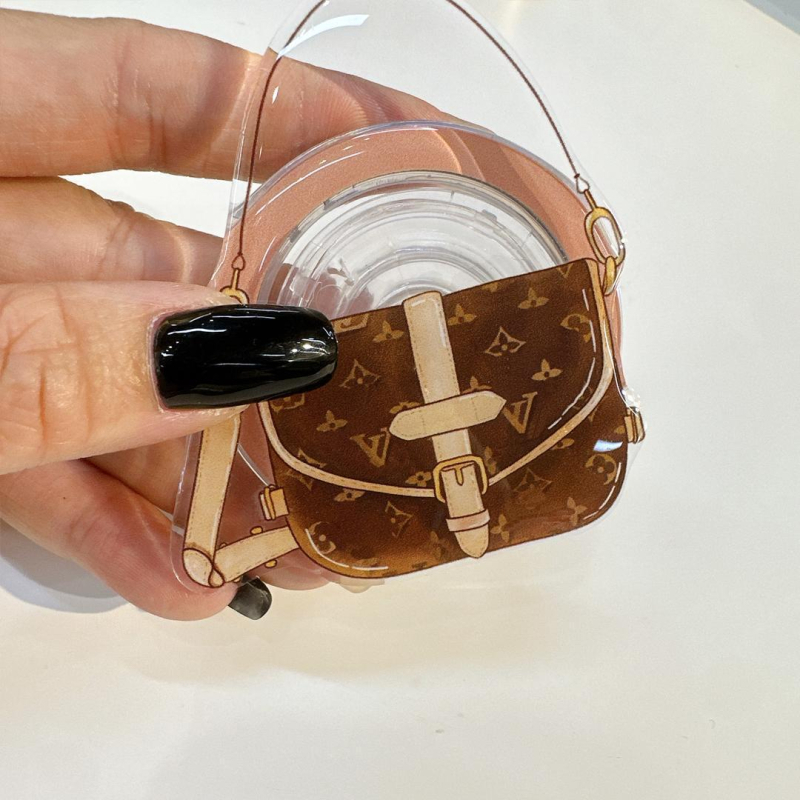 Držač za mobitel s magnetskim kućištem, povlačajući dizajn, plastični materijal, crtani stil, kompatibilan s Apple i Android uređajima.