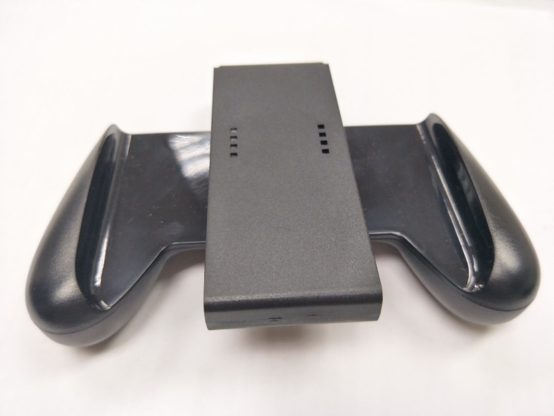 Switch държач за ръкохватка — ABS материал, директен интерфейс за включване, съвместим с ляво и дясно Joy-Con, тегло 74 g, включена чанта за захват