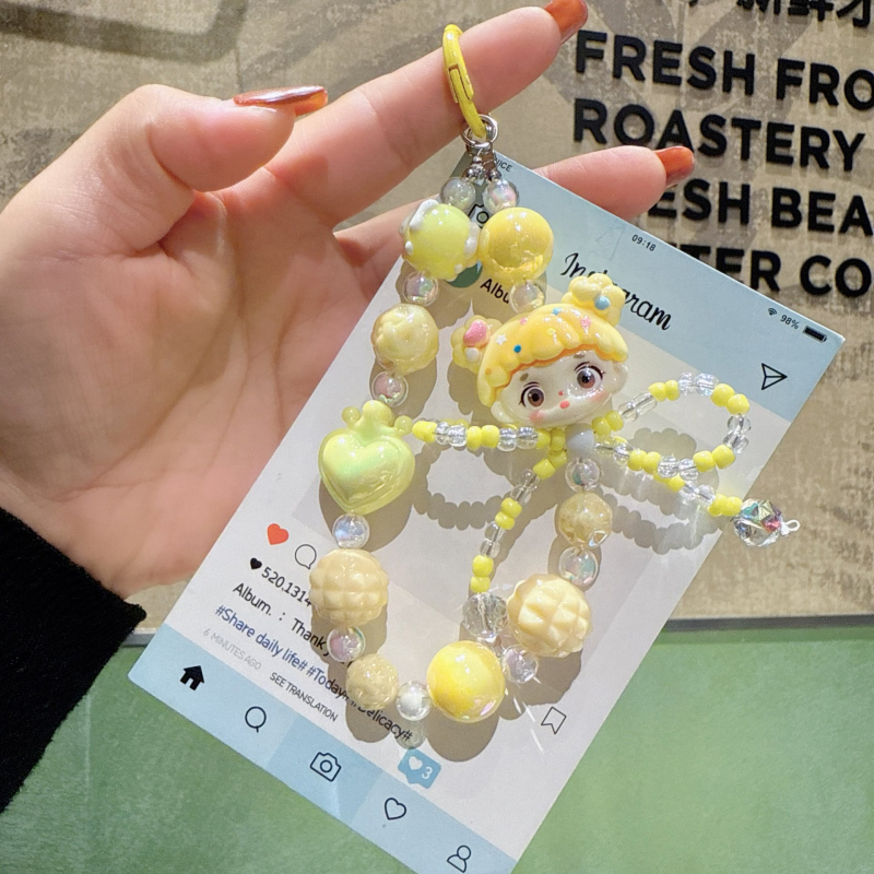Karikatura-akrilni privjesak za telefon s kristalnom mašnicom i nizu od perlica (Brand: Hibiscus Jewelry; Materijal: Akril; Obrada: Elektropaljivanje; Vzor: Zvjezdice/Sunce i Mjesec/Nebesa; Stil: Crtani, Dodaci za telefon)