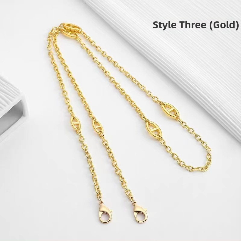 Ζώνη τσάντας/ώμου Yu Yi, μεταλλική, γεωμετρικό μοτίβο, εξουσιοδοτημένη ιδιωτική μάρκα, άνοιξη 2023.