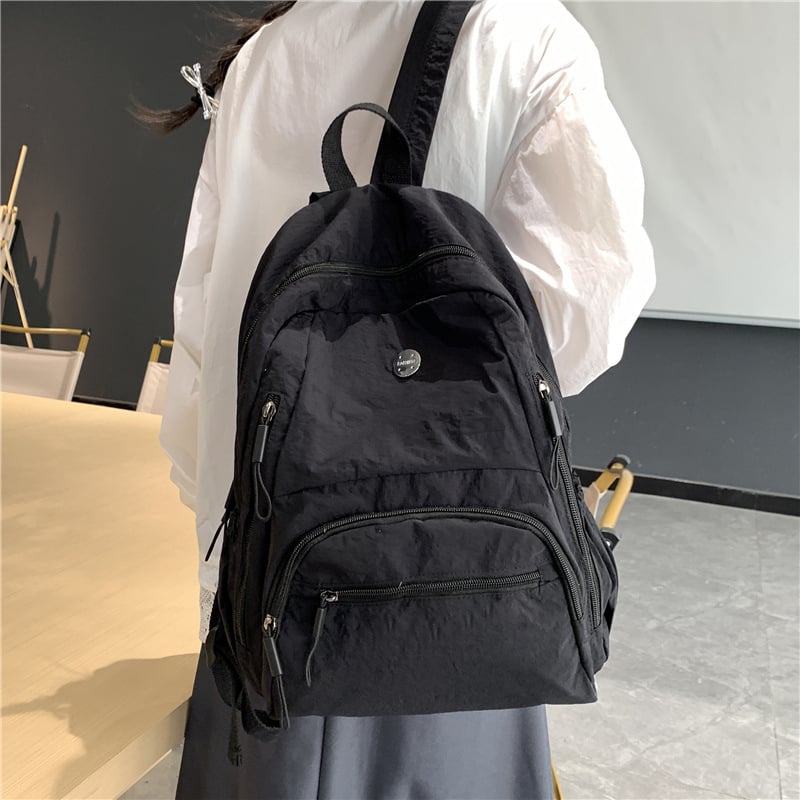 Rucsac din nylon, capacitate 20–35 L, compartiment pentru laptop, bretele curbate
